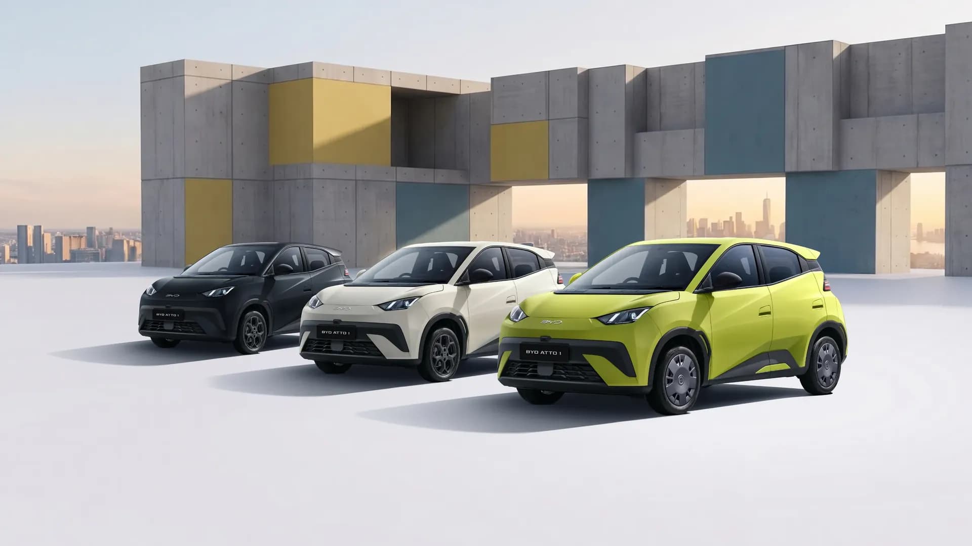 Tiga unit BYD Atto 1 warna Cosmos Black, Apricity White, dan Sprout Green di depan bangunan beton